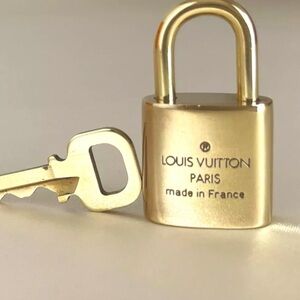 Authentic Louis Vuitton Padlock with Key.
